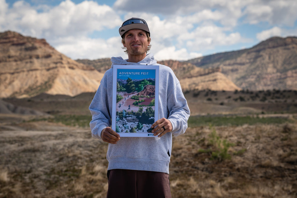 Finisher holding custom gravel race award — hand-drawn art print