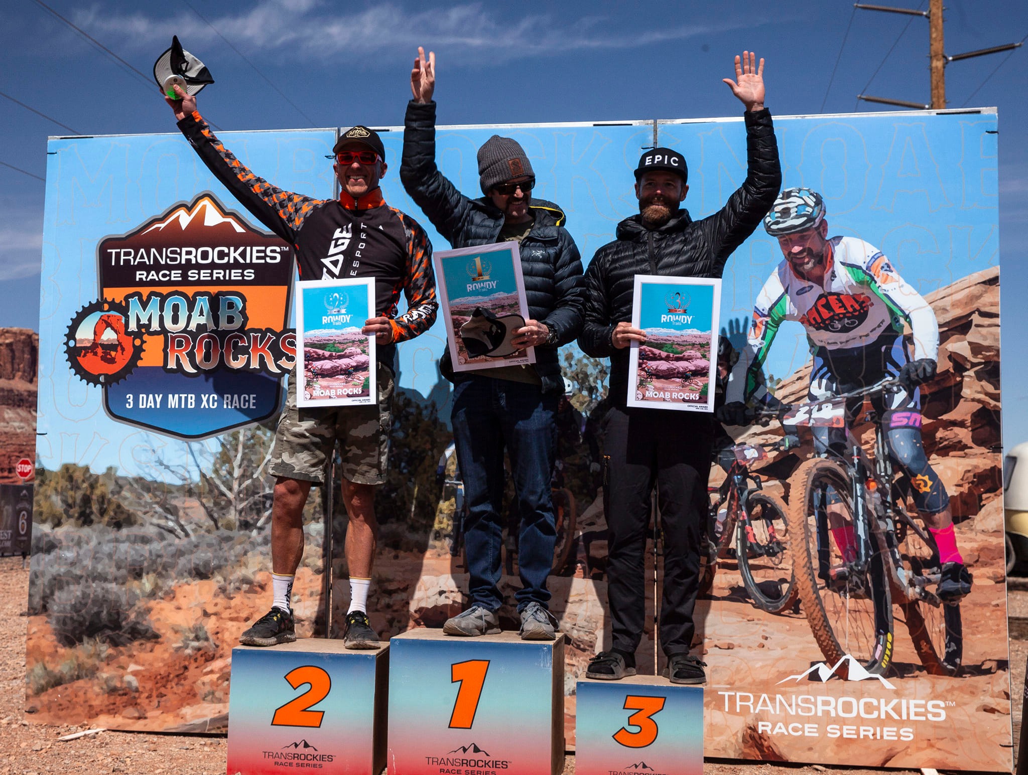 Custom MTB race awards at Moab Rocks podium — hand-drawn finisher posters